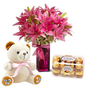 6 lilies vase with 16 ferrero chocolates and 6 inch teddy
