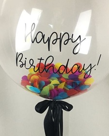 Transparent Balloon with paper confetti inside and happy birthday print on balloon